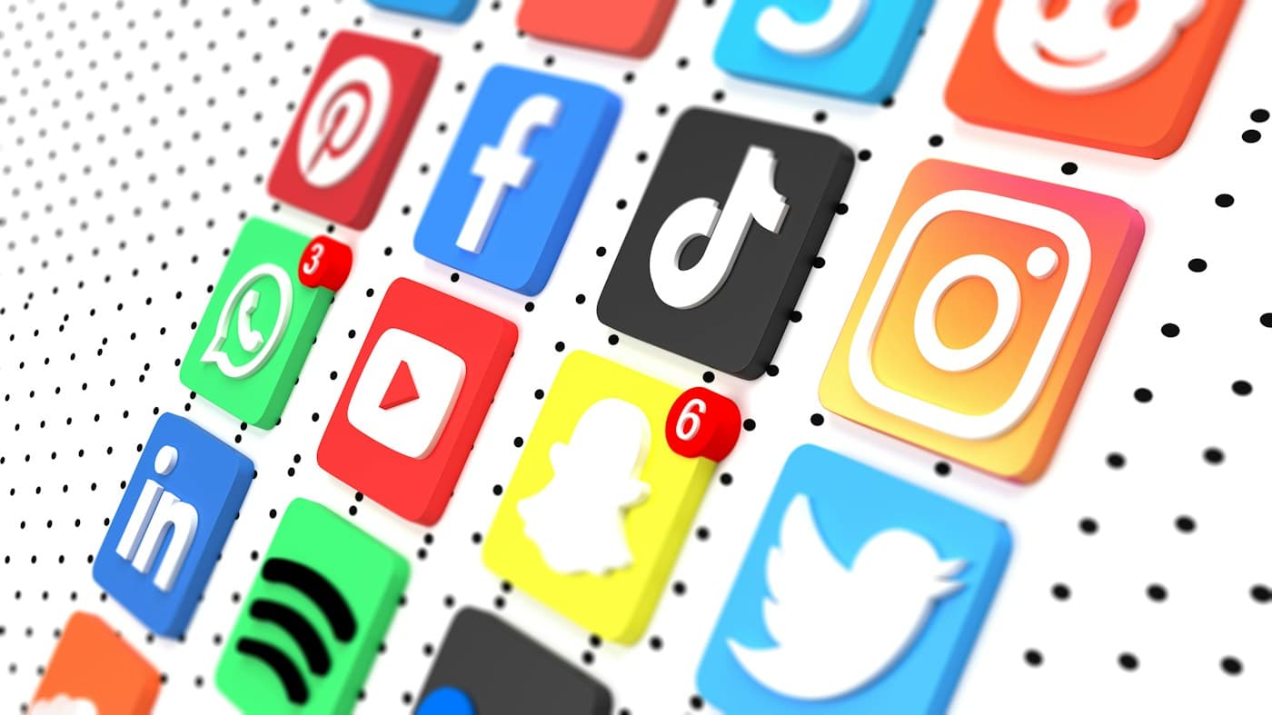 Rows of social media app icons arranged in a grid, two of them carrying unread notification badges.